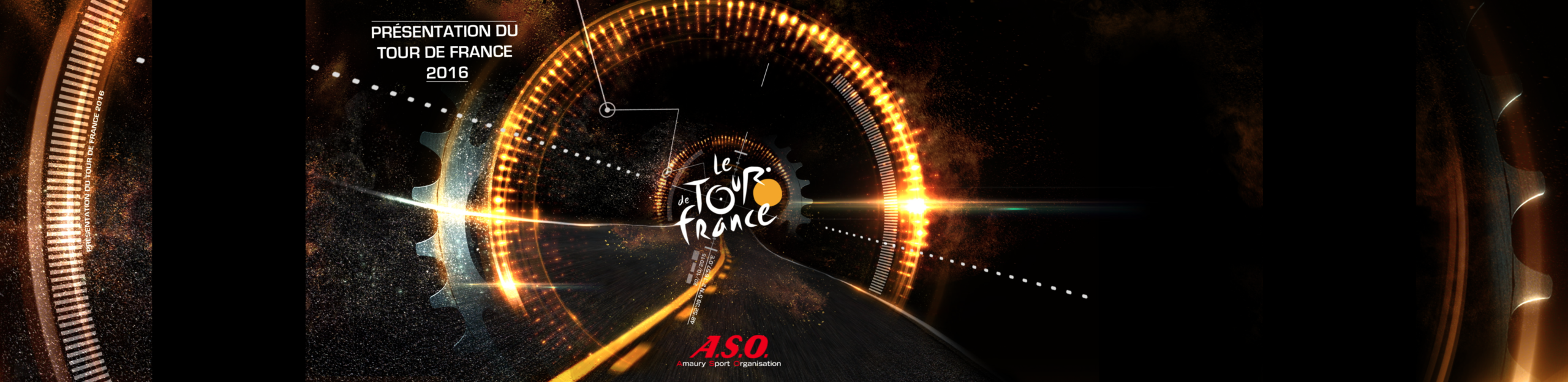 The Tour de France 2016 logo surrounded by golden mechanical rings, with the A.S.O. signature