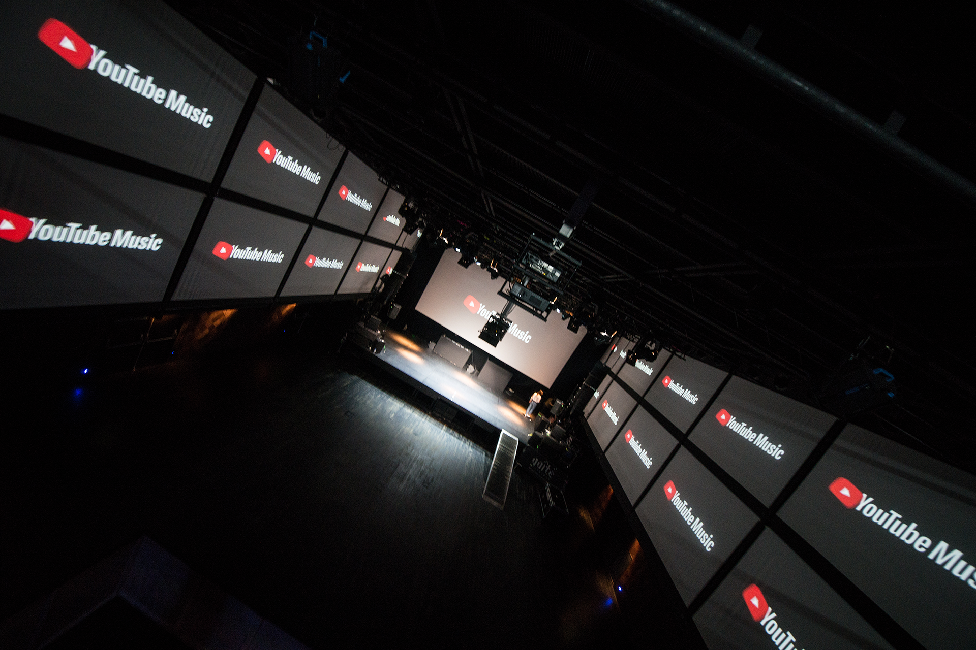 YouTube Music logos repeated across the 270-degree screen arrangement.