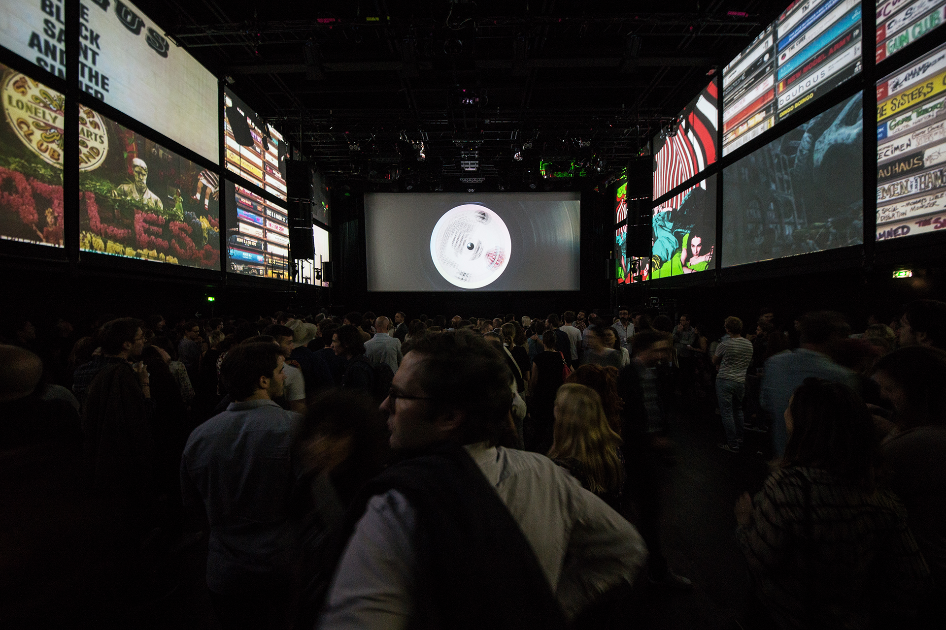 Guests facing the stage and vinyl-inspired visuals during the launch.