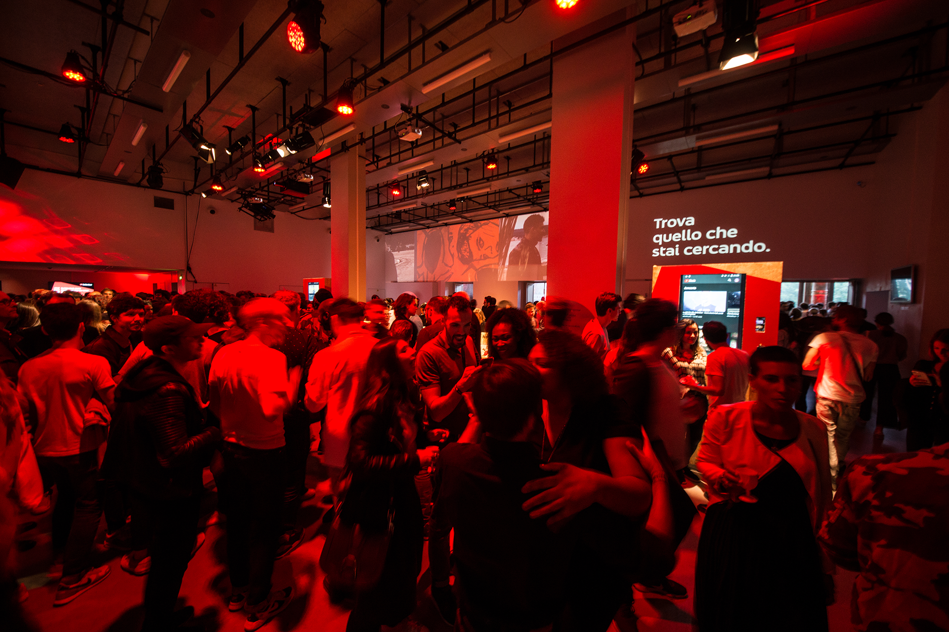 The foyer during the launch event, with animated graphics above the crowd.